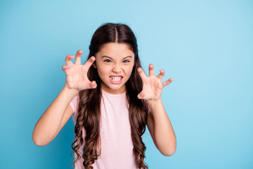 Portrait of evil small naughty kid like wild animal show teeth have fun joy funky funny cute dressed fashionable clothing isolated on blue background