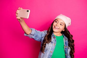 Portrait positive cheerful satisfied kid have holiday summer travel use user gadget make photos chill hold hand social network blog blogger video call stylish outfit isolated pink background