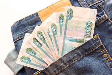 Money in the pocket of jeans. Rubles in jeans pocket. Top View. Russian money in a jeans pocket, closeup.Russian money stick out of the back pocket of jeans.finance and currency concept.