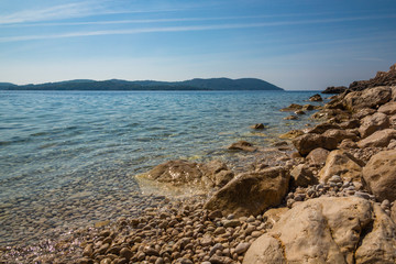 Stony beach on the Adriatic Sea near Orasac, Croatia