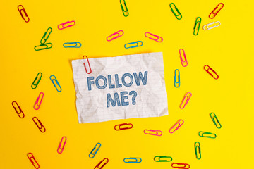 Text sign showing Follow Me Question. Business photo showcasing go or come after demonstrating or thing proceeding ahead Blank crushed paper sheet message clips binders plain colored background
