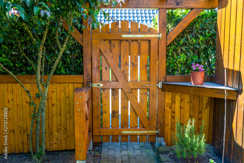 Wooden Gate And Fence On The Back Of The Home Garden The Gate Is