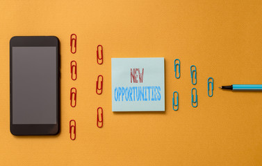 Text sign showing New Opportunities. Business photo text A situation that makes it possible to do something Colored blank sticky note clips smartphone ballpoint trendy cool background