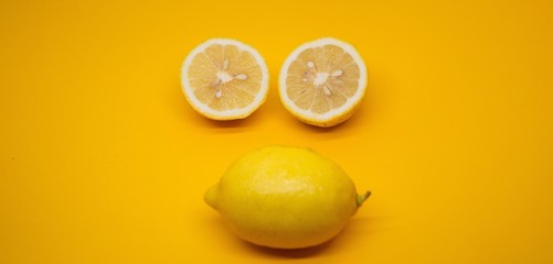 three lemon in a yellow background