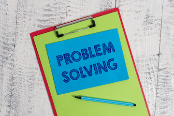 Text sign showing Problem Solving. Business photo showcasing process of finding solutions to difficult or complex issues Colored clipboard blank paper sheet marker sticky note wooden background