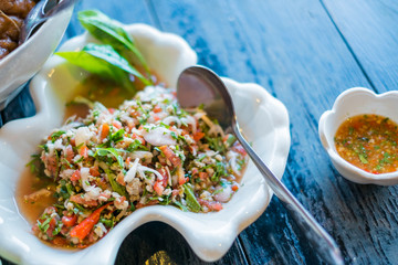 Tuna with tea leaves and mix vegetables , spicy salad