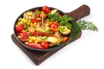 Grilled vegetables in a cast iron grilling pan, close-up, isolated on white background
