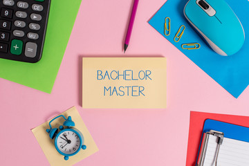 Conceptual hand writing showing Bachelor Master. Concept meaning An advanced degree completed after bachelor s is degree Mouse calculator sheets marker clipboard clock color background