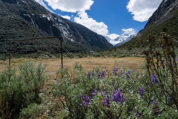 mountain landscape in the high valleys of the Cordillera Blanca with a rudimentary makeshift football field