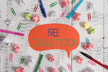 Handwriting text Free Consultation. Conceptual photo Giving medical and legal discussions without pay Blank speech bubble pens clips crushed paper balls vintage retro table