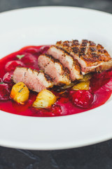 duck breast and berry sauce (fine dining) bon appetit. top food background. copy space