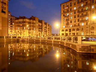 Fototapeta na wymiar Night landscape of urban architecture of the city