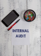 Conceptual hand writing showing Internal Audit. Concept meaning Evaluates the effectiveness of the...