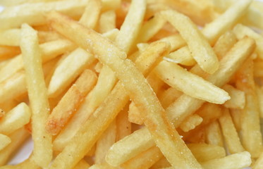French close up of fried mixed with salt arranging on white background