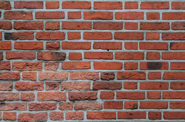 Brick wall of red color texture background
