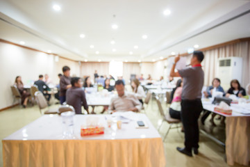blurry image. speaker or lecturer with startup business team brainstorming on meeting workshop....