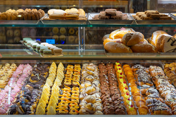 Italian sicilian pastries with chocolate and white cream.