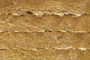 Mineral stone basalt wool. Modern insulation of buildings. Creative vintage background. Plate material.