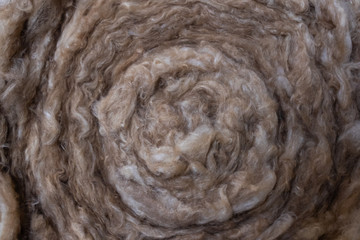 Mineral stone basalt wool. Modern insulation of buildings. Creative vintage background.Roll material.