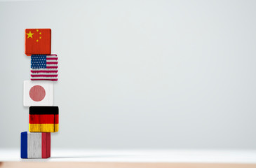 Print screen of flag on wooden cubic of top 5 the biggest economic countries include China USA Japan Germany and France.