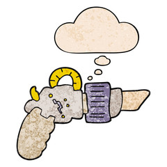 cartoon ray gun and thought bubble in grunge texture pattern style