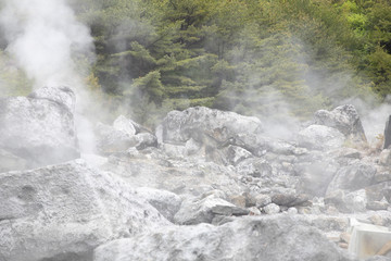 stone or rock with hell hot springs located at active volcano mountain.