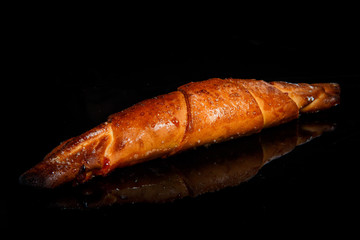 closeup golden frosted cinnamon roll with sugar decoration