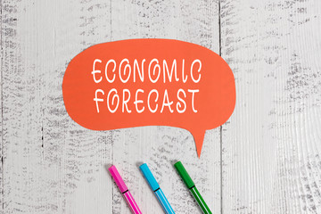 Handwriting text writing Economic Forecast. Conceptual photo Process of making predictions about the economy condition Ballpoints blank colored speech bubble wooden rustic vintage background