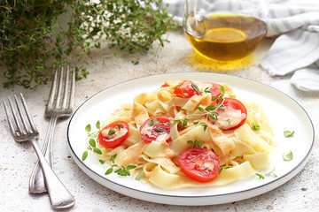 Pasta Fettuccine with cream sauce and cherry tomatoes