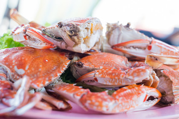 Steamed crabs on a plate on the table.