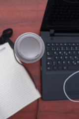 Fototapeta na wymiar Wood office desk table with laptop, cup of coffee