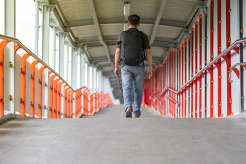 Asian man walking in the city