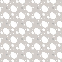 Seamless pattern of a variety of dots and spots of different colors and shapes, for the decoration of the fabric, vector image