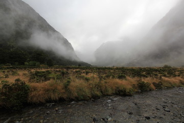 field with river from snows cool and fog and mountain background