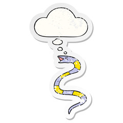 cartoon snake and thought bubble as a distressed worn sticker