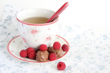 Cup of tea, chocolate and raspberry