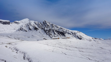 Traditional wooden houses on the mountainside in Grindelwald, Switzerland.