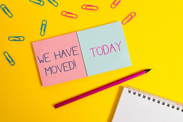 Handwriting text We Have Moved. Conceptual photo To go from one residence or location to another Relocate Colored square blank sticky spiral notepads pencil clips color background