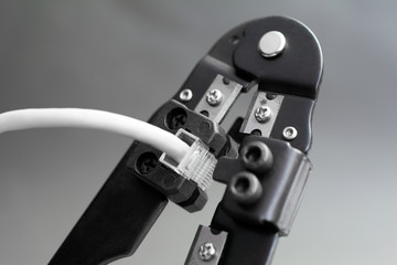 Champper Ethernet patch cable, Ethernet Network Cable Crimp Crimping Crimper Tool, close up gray background