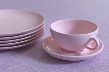 3D rendering of a cup and piled plates