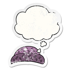 cartoon hat and thought bubble as a distressed worn sticker