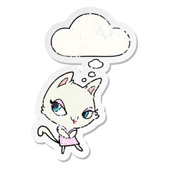 cartoon female cat and thought bubble as a distressed worn sticker