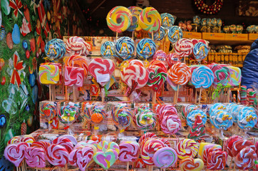 Christmas lollipops of different colors, flavors and shapes at the Christmas market