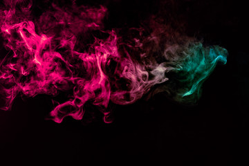 Colored background with winding clouds of smoke from patterns of different forms of pink, green and blue colors with tongues of flame on a black isolated background