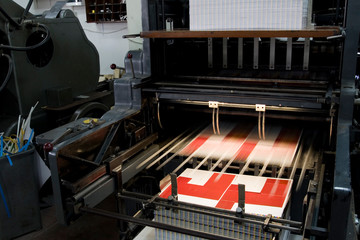 Paper die cutting machine press in motion