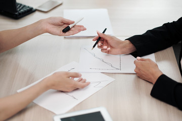 Close-up desktop. Tablet, charts and documents. The concept of team office work. Women at work.