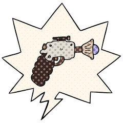 cartoon ray gun and speech bubble in comic book style