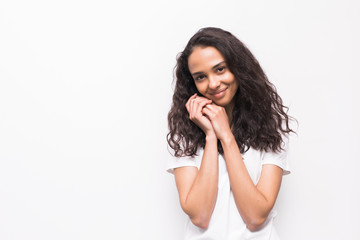 Fototapeta premium Beautiful smiling woman stands over studio wall