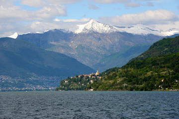 view over Lago Maggiore to snow capped mountains
