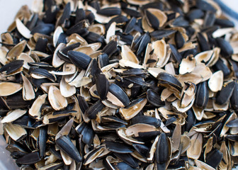 Husk from sunflower seeds piled a handful